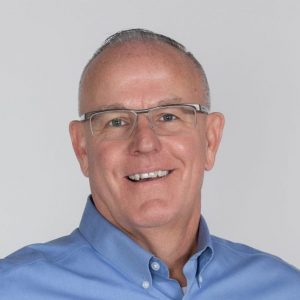 A headshot of Jim Hackett