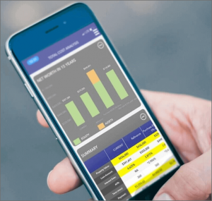 A mobile phone in someone's hands showing graphs and charts